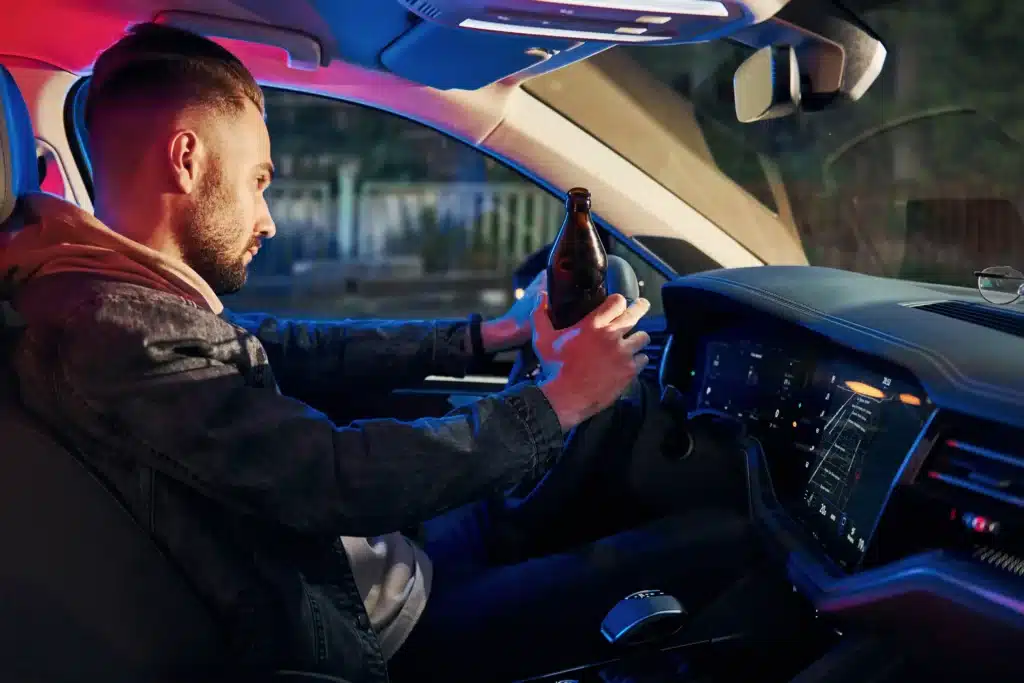 A man drinking and driving