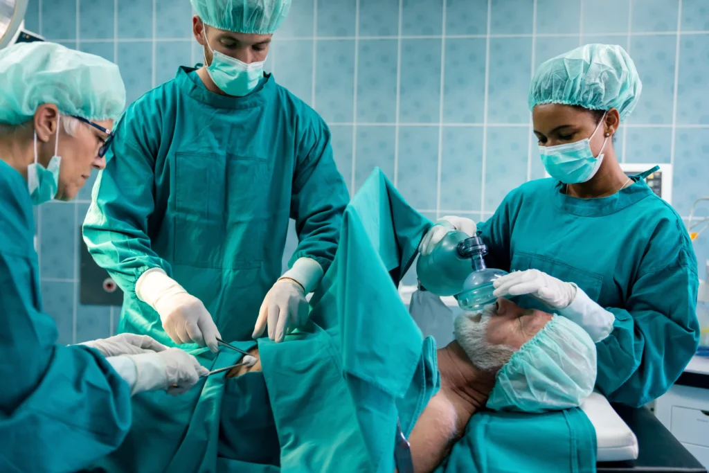Doctors in the OR attending to a patient