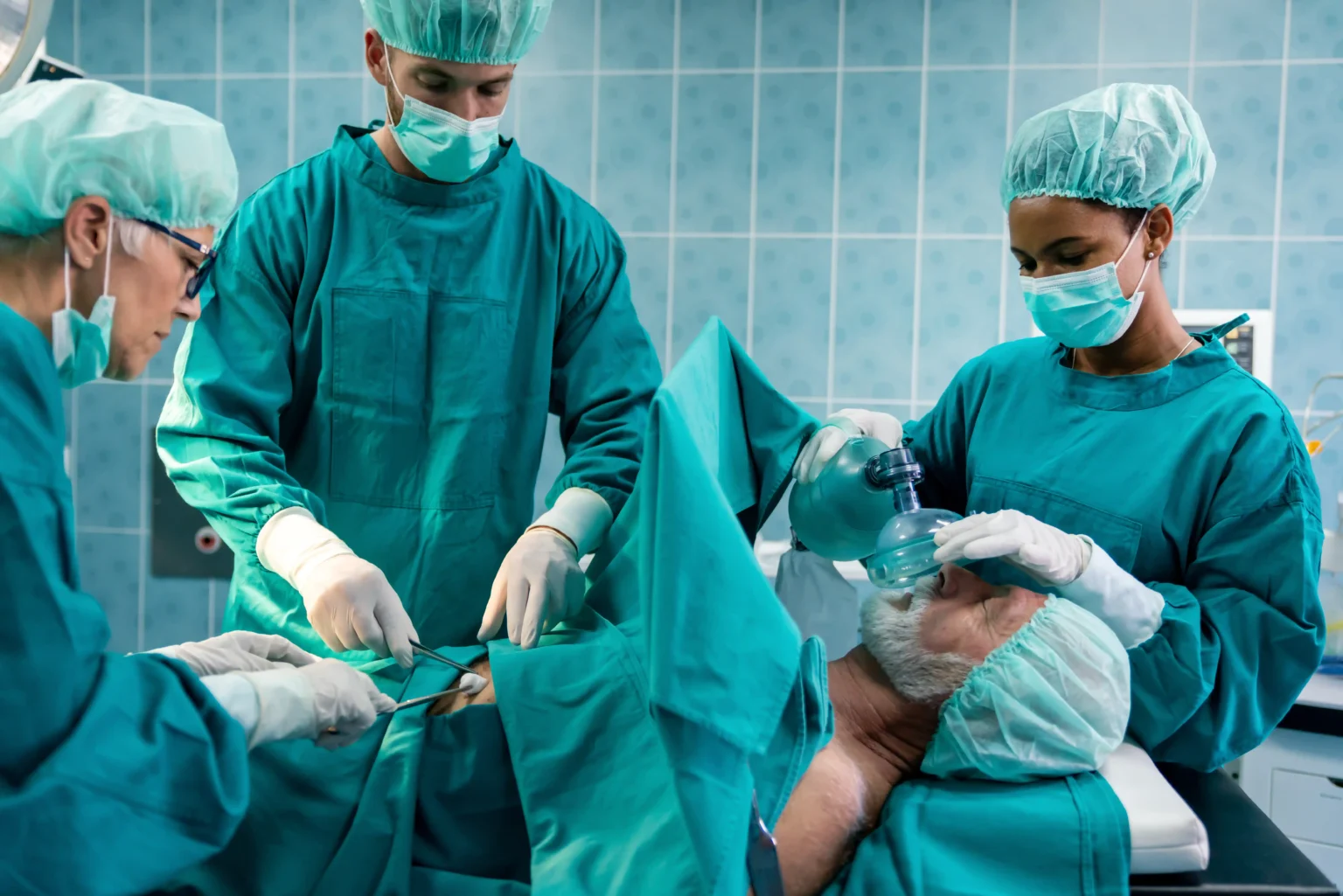 Doctors in the OR attending to a patient
