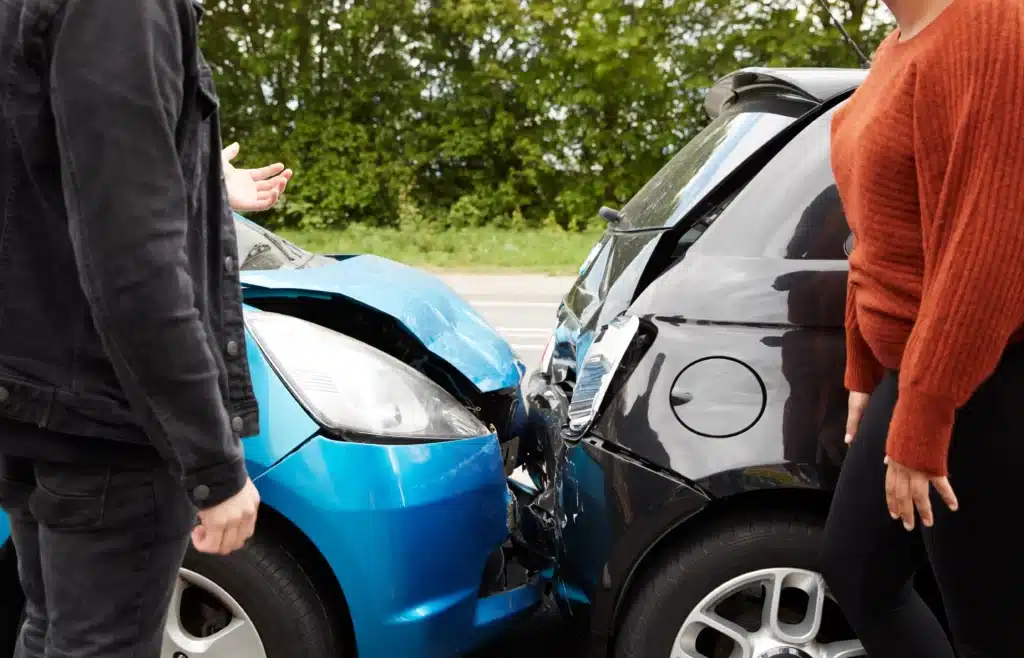 A man and a woman arguing over a rear accident