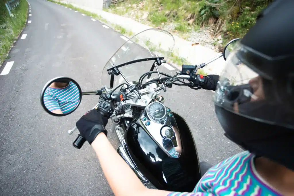 A lady riding a motorcycle