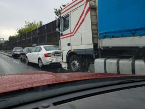 semi truck rear ended car on highway