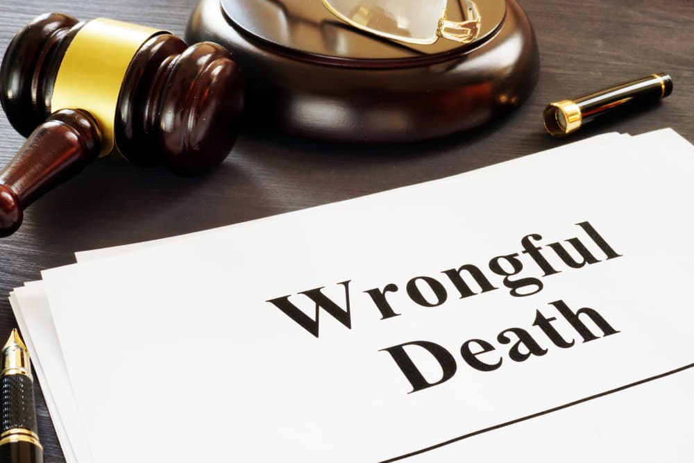 court document reading wrongful death on table with gavel