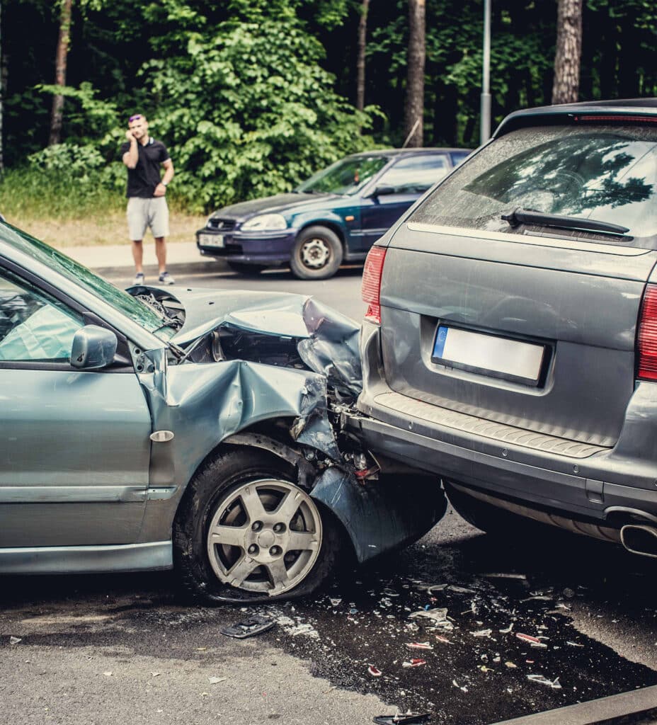 Close up smashed cars on a road.