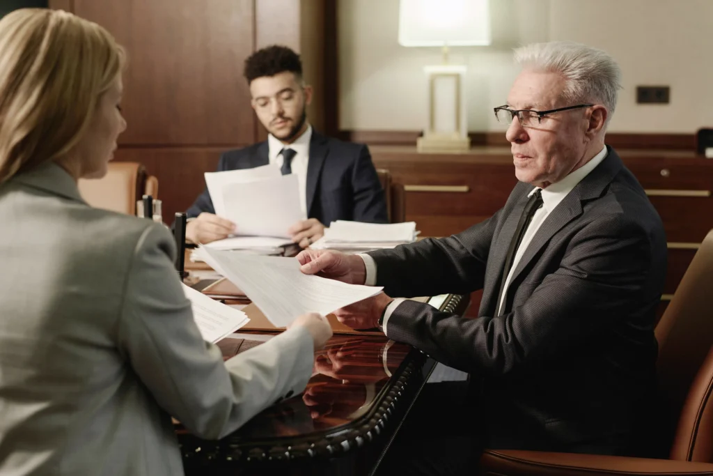A group of attorneys and passing documents