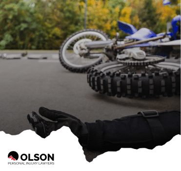 a fallen motorcycle rider and the motorcycle