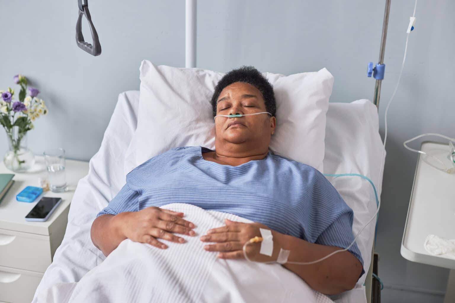 senior woman laying on hospital bed