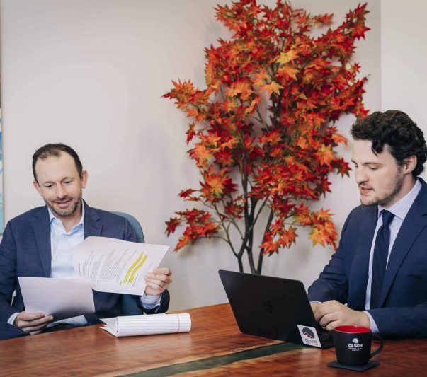 attorney phillip meinkoth and coo rob buick reviewing documents together