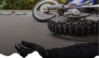 a fallen motorcycle rider and the motorcycle