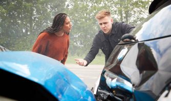 two angry motorists arguing over responsibility for car accidents