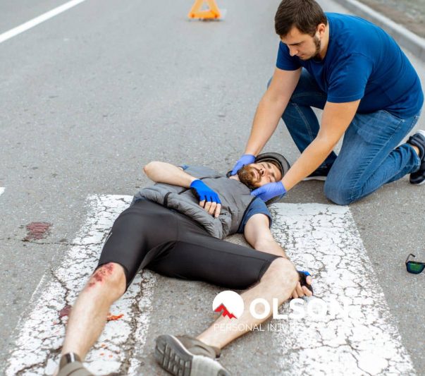 a pedestrian lying on the road after an accident