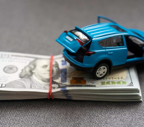 car and money. concept of car, Rent, car insurance, Toy car and money over white