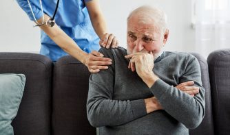 nurse and old man in a nursing home