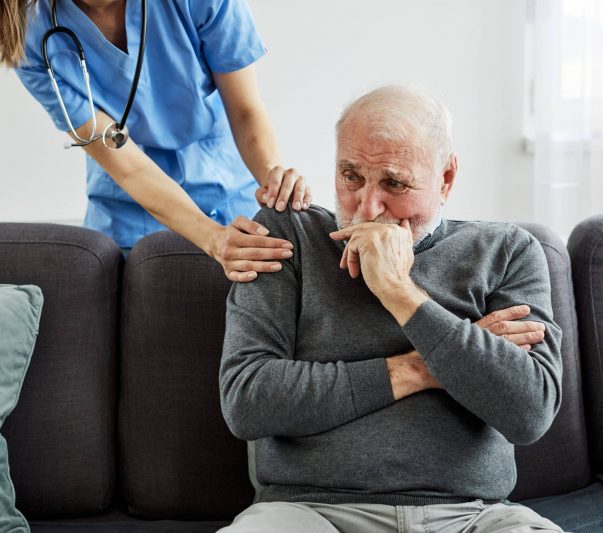 nurse and old man in a nursing home