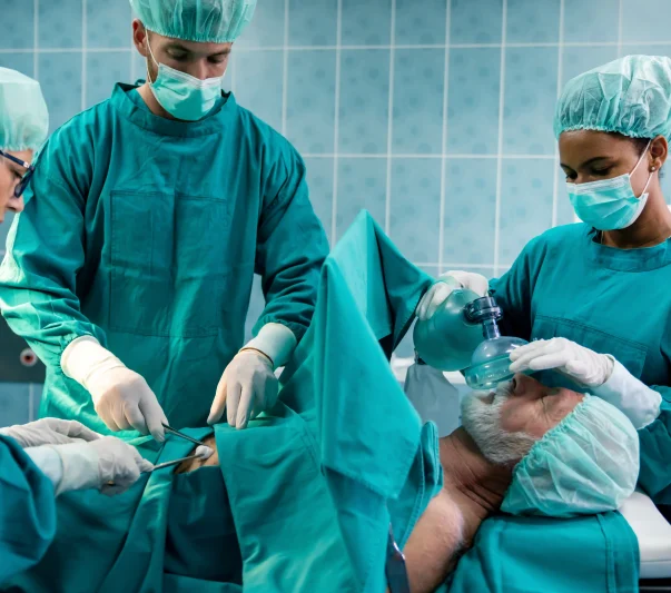 Doctors in the OR attending to a patient