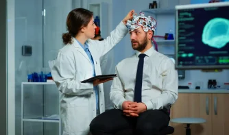 A doctor testing the something in a man's head