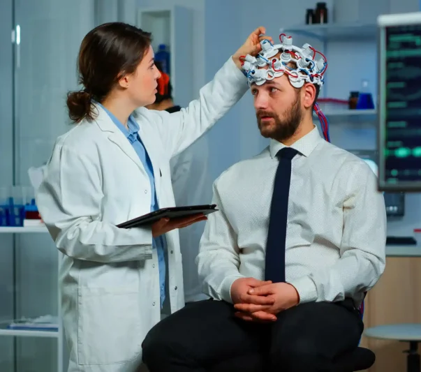 A doctor testing the something in a man's head