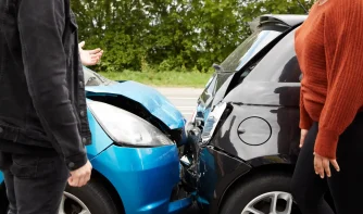 A man and a woman arguing over a rear accident