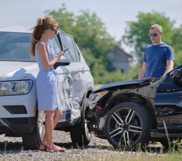 Two drivers having argument over who is guilty in car crash accident. Road safety and insurance concept.