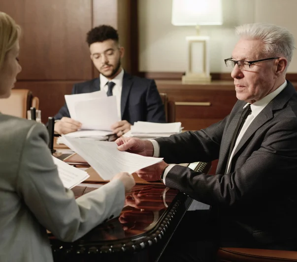 A group of attorneys and passing documents