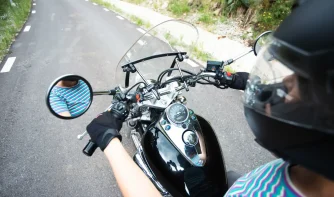 A lady riding a motorcycle