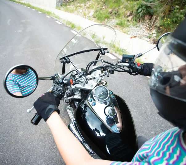 A lady riding a motorcycle